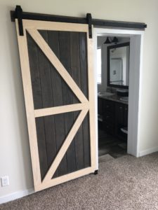 The Garfield custom modular home - sliding barn style door